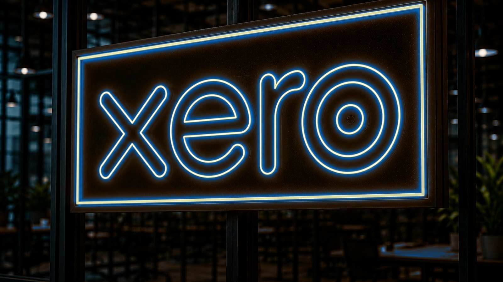 Xero neon sign glowing in a darkened accounting office